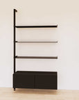 Retail display shelving unit with black shelves, black vertical posts, and base cabinets in a 48-inch configuration, shown with open display shelving.