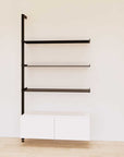 Retail display shelving unit with white shelves, black vertical posts, and base cabinets in a 48-inch configuration, shown with open display shelving.