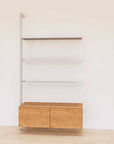 Retail display shelving unit with Tea for Two shelves, satin vertical posts, and base cabinets in a 48-inch configuration, shown with open display shelving.