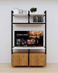 Modular media shelving unit with white shelves and black vertical posts, with Tea for Two wood cabinet storage, two bays, shown with open shelf levels.