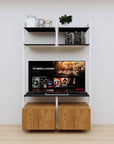 Modular media shelving unit with black shelves and white vertical posts, with Tea for Two wood cabinet storage, two bays, shown with open shelf levels.