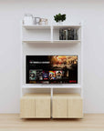Modular media shelving unit with white shelves and white vertical posts, with Casting Light wood cabinet storage, two bays, shown with open shelf levels.