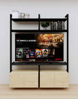Modular media shelving unit with black shelves and black vertical posts, with Casting Light wood cabinet storage, two bays, shown with open shelf levels.