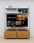 Modular media shelving unit with satin shelves and satin vertical posts, with Tea for Two wood cabinet storage, two bays, shown with open shelf levels.