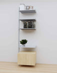 Modular media shelving extension with satin shelves and satin vertical post, with Casting Light wood cabinet storage, one bay, 24-inch shelf width, shown with open shelf levels.