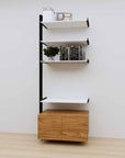 Modular media shelving extension with white shelves and black vertical post, with Tea for Two wood cabinet storage, one bay, 31-inch shelf width, shown with open shelf levels.