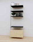 Modular media shelving extension with black shelves and satin vertical post, with Casting Light wood cabinet storage, one bay, 31-inch shelf width, shown with open shelf levels.