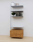 Modular media shelving extension with satin shelves and satin vertical post, with Tea for Two wood cabinet storage, one bay, 31-inch shelf width, shown with open shelf levels.