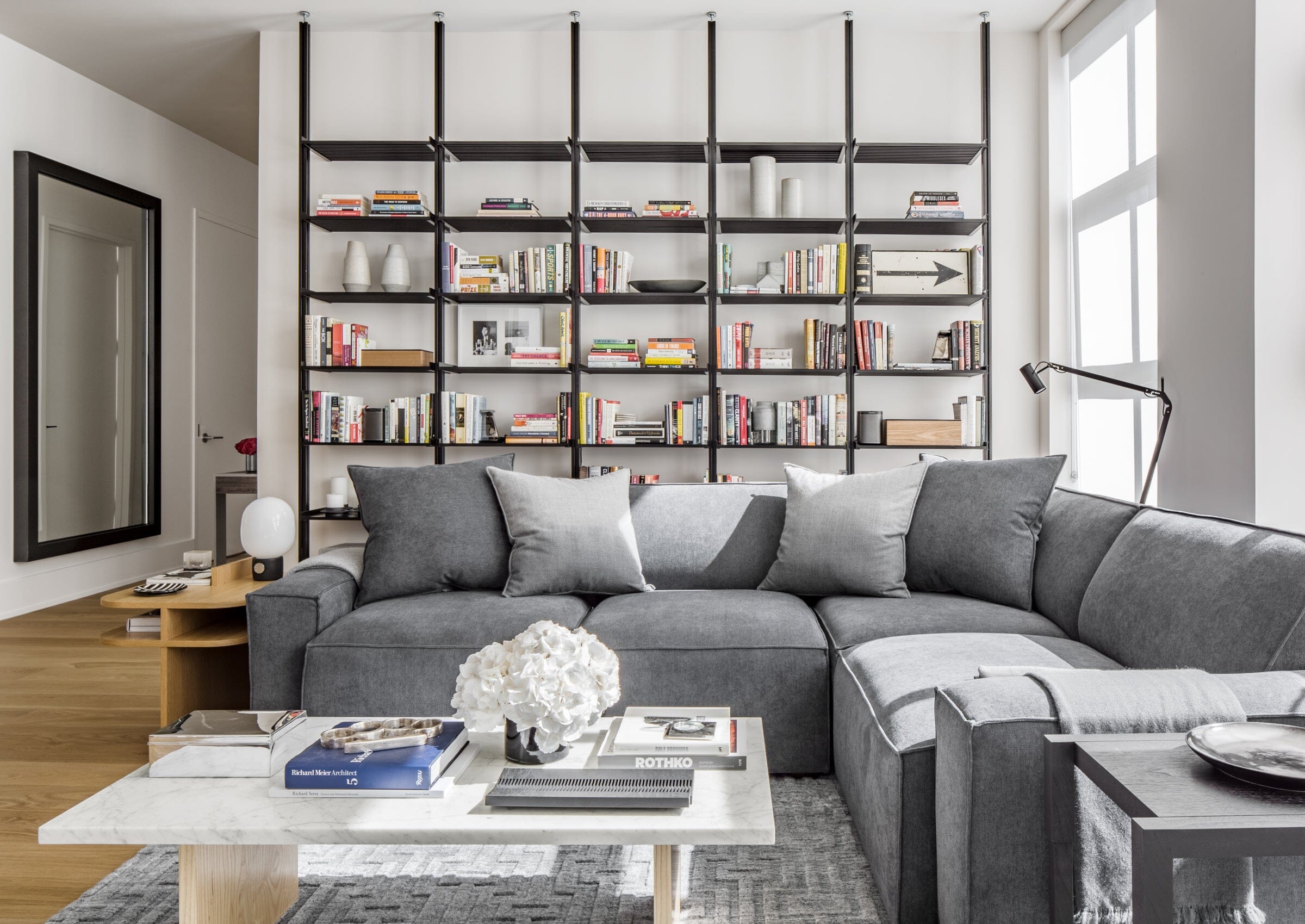 Interior Designer Uses Modern Shelving to Enhance Client’s Apartment