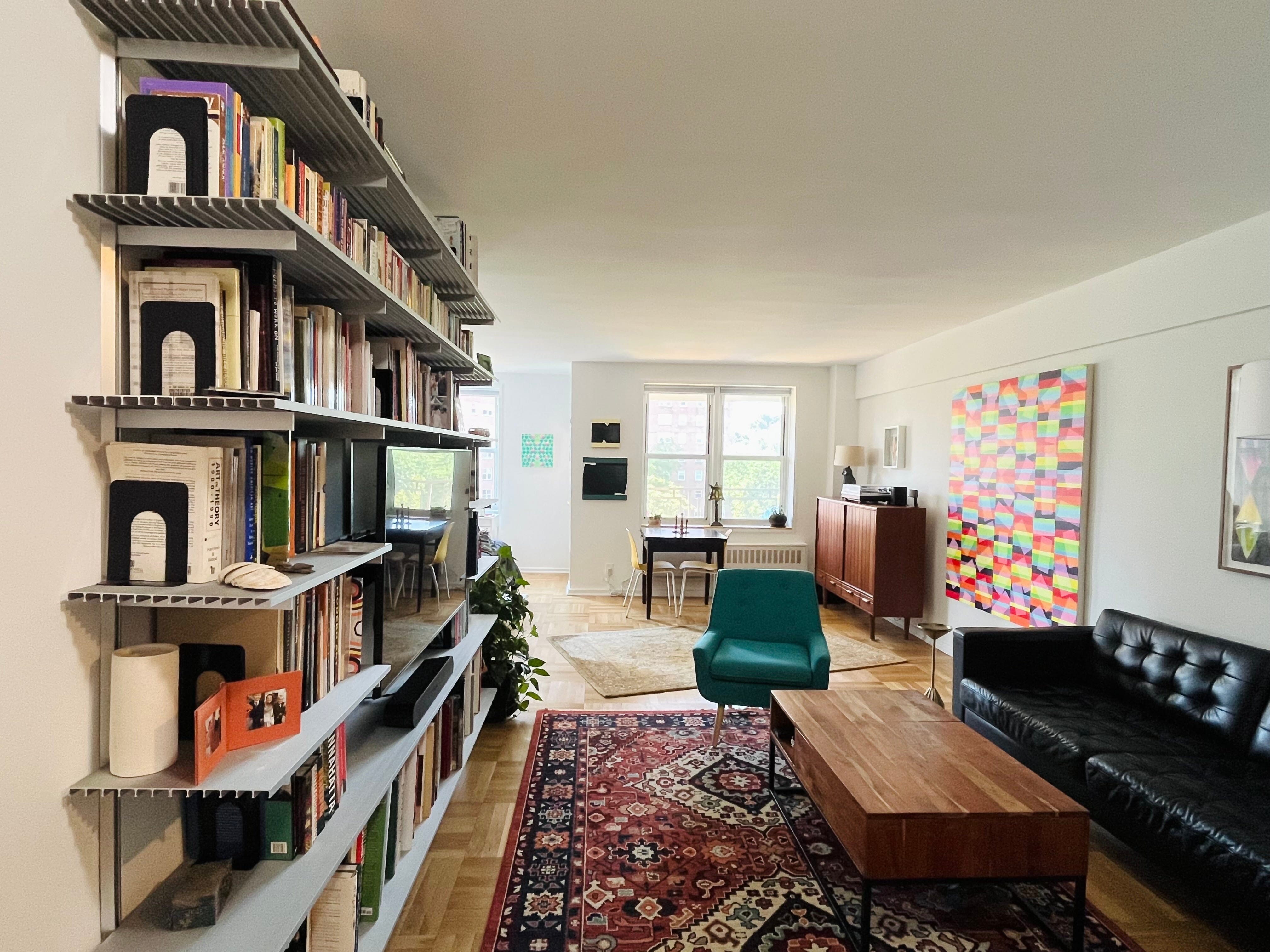 Couple Uses Shelves as a Media Wall in Their New York Apartment