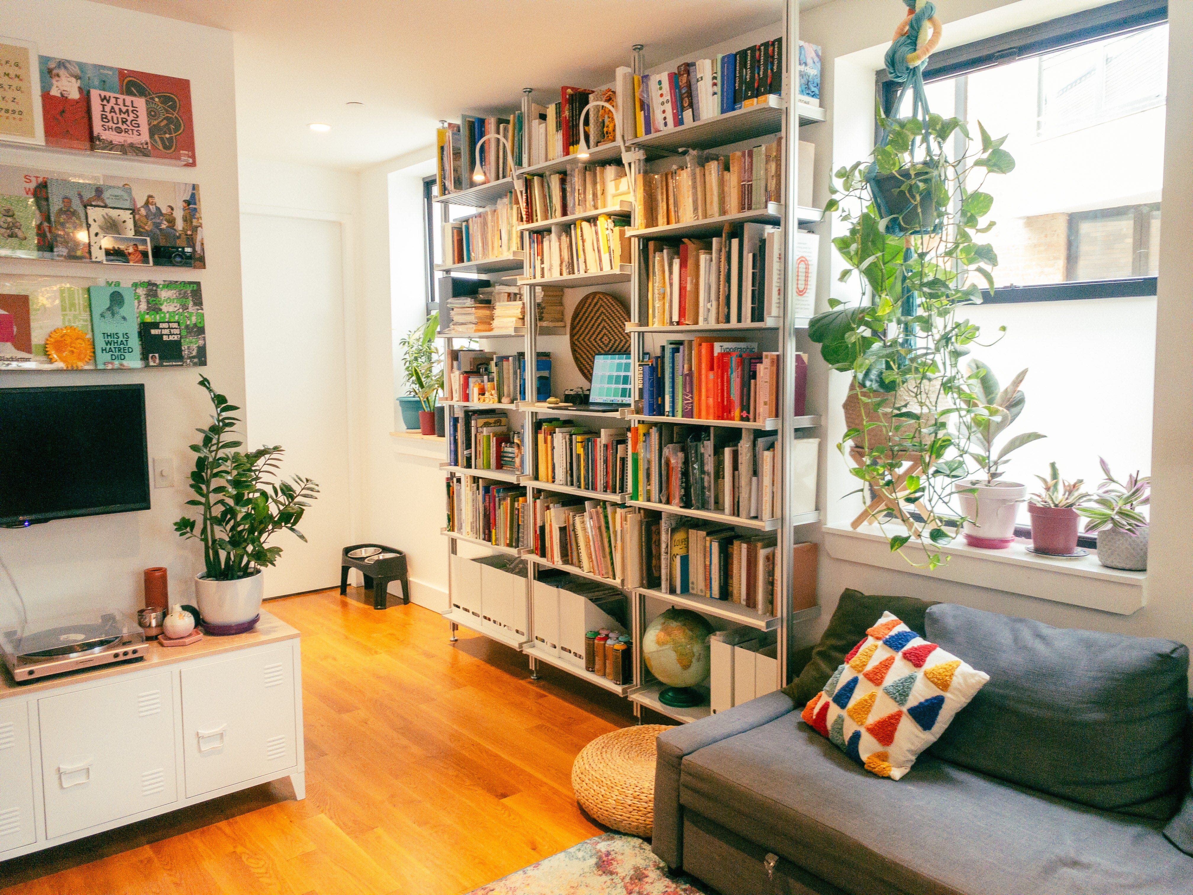 New York Book Designer Uses Modern Shelving to Organize Her Massive Book Collection