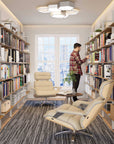 Sleek aluminum shelving unit with books and decor in a modern interior.