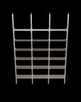 Modular shelving unit with warm gray shelves, satin vertical posts, and three bays, shown as a front-facing product render with six open shelf levels and floor-to-ceiling supports.