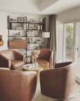 Elegant living space featuring Modern Shelving's PAL series shelving units full of decorative items and books, showcasing versatile and stylish storage solutions.